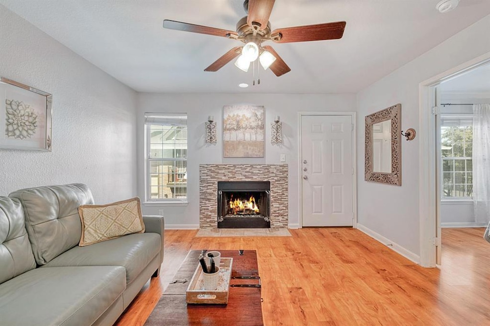 Living room with light wood-style floors, ceiling