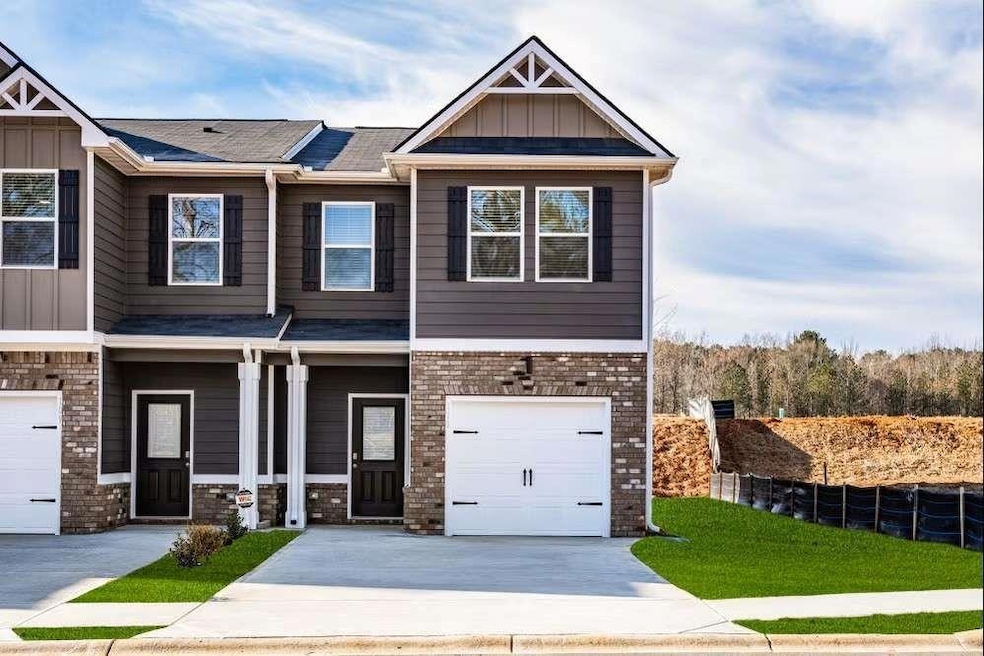FRONT ELEVATION IS BRICK & HARDIPLANK