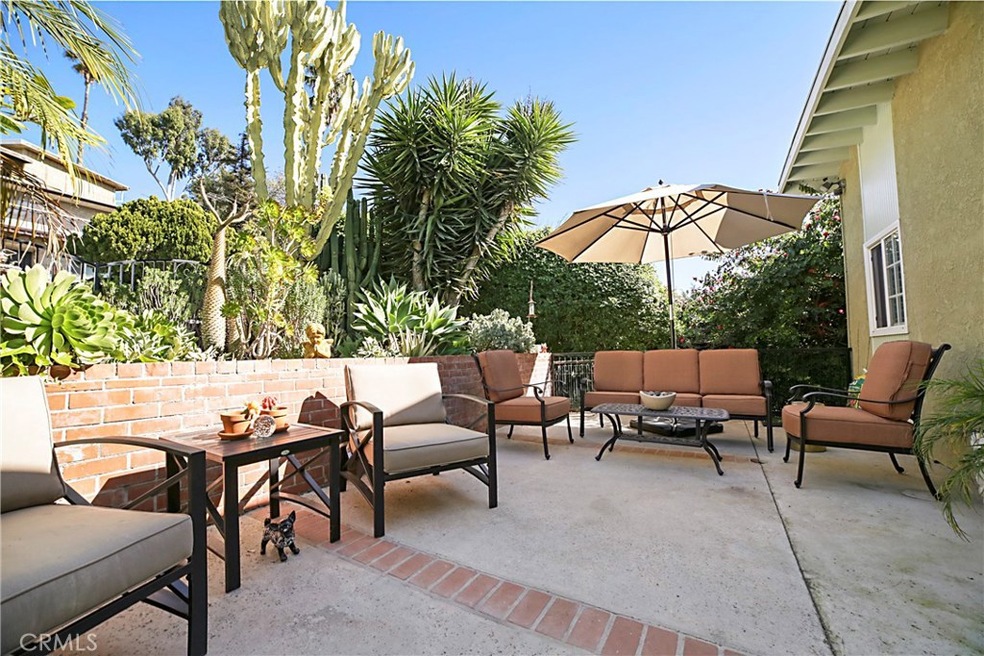 Front Courtyard with lush suculant and fountain garden.