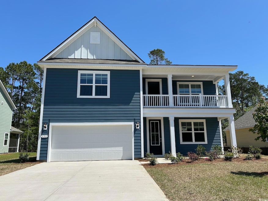 Traditional-style home featuring a balcony, board 