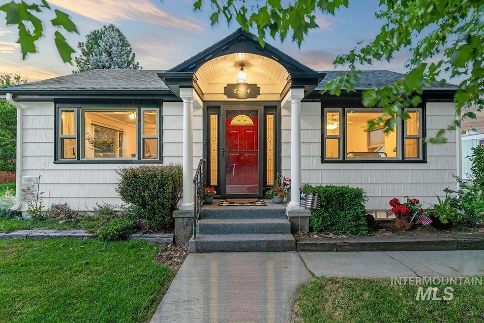 View of front of home featuring a shingled roof
