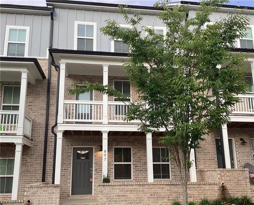 View of front of home featuring a balcony