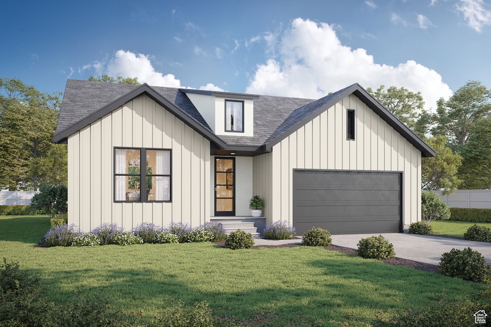 Modern inspired farmhouse featuring a front yard, board and batten siding, and concrete driveway