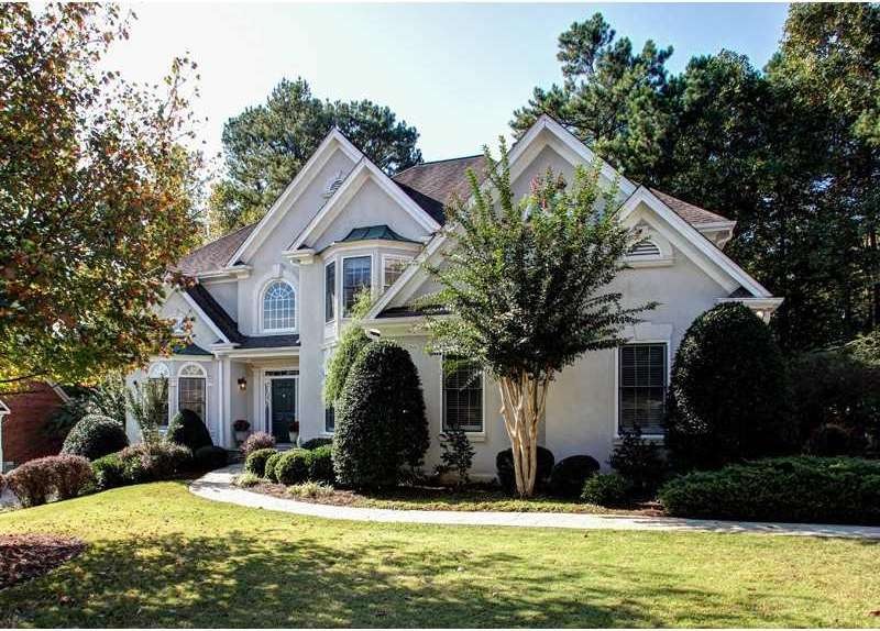 Facade/Exterior Front. Professionally landscaped a