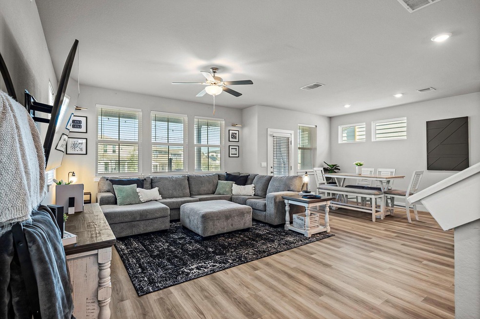 The open and airy floor plan is filled with natural light, creating a bright and welcoming space perfect for everyday living and entertaining. 
