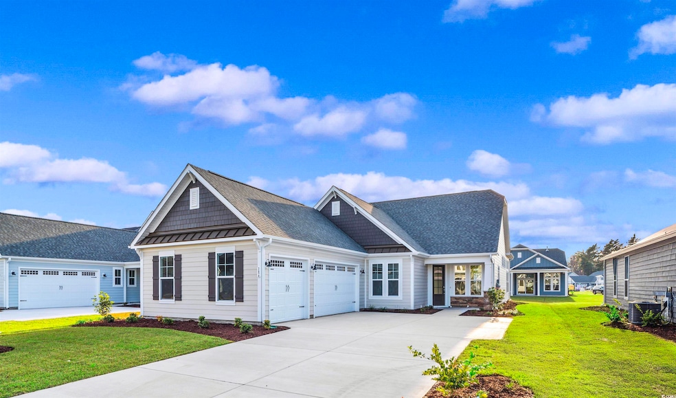Craftsman house with a garage, a front lawn, and c