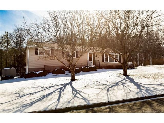 Exterior with large front yard.