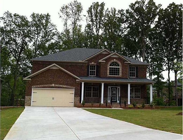 Exterior Front. 3 sided brick exterior with two to