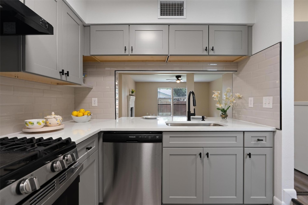 Kitchen featuring stainless steel appliances, ven