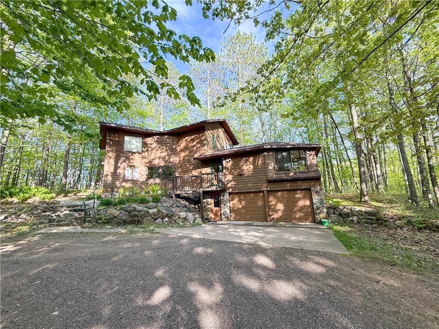Front of home with 2-car tuck-under garage.