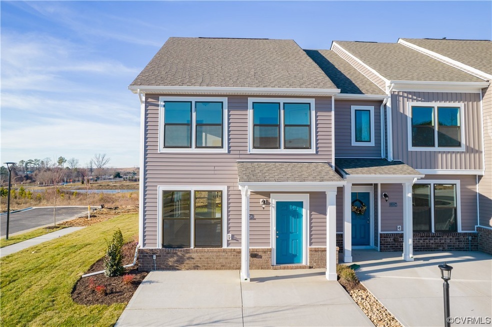 View of property with a front lawn