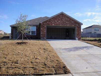 Ranch-style home featuring a garage