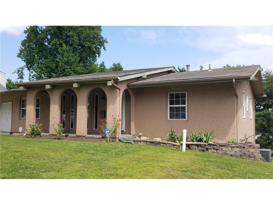 Front of home - covered porch, stucco exterior for