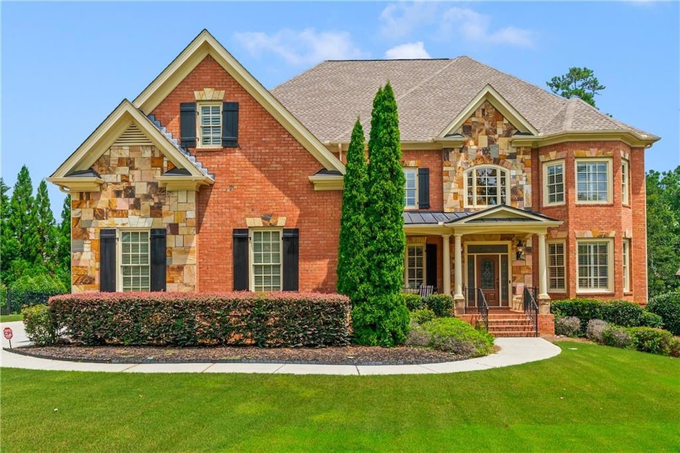 Craftsman-style house featuring a front yard and c