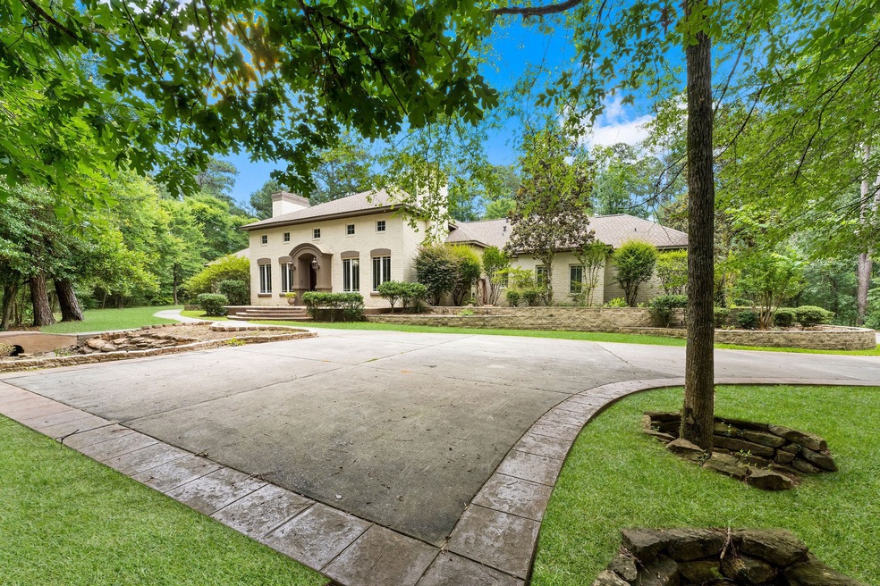 Sitting on 2.47 mostly wooded acres, this expansive home has something to offer everyone ... parking for multiple cars, an unbelievably impressive entry, an entertainer's delight kitchen, a 