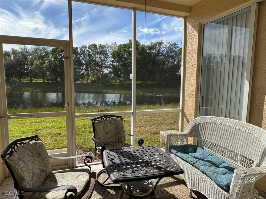 Sunroom / solarium featuring a wealth of natural light and a water view