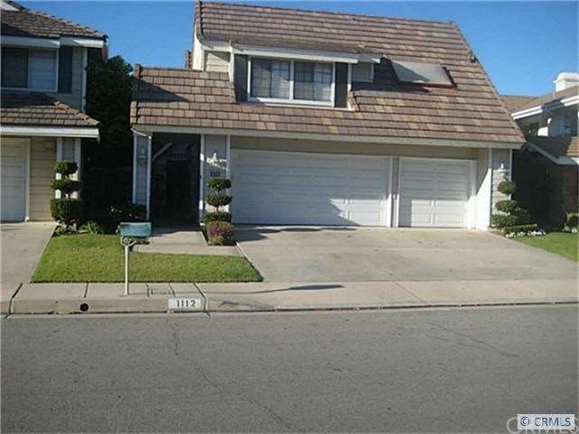 Front of house showing 3 car garage