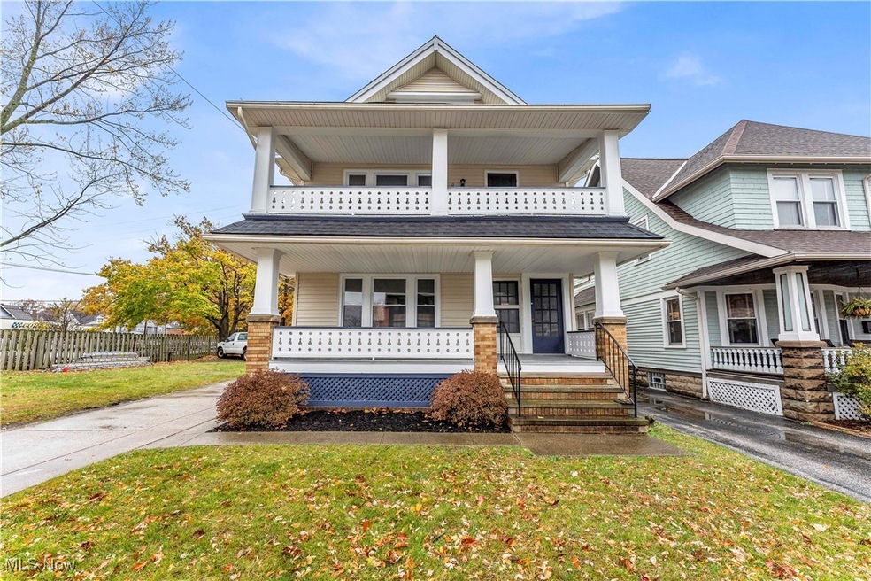 View of front facade with a porch and a front lawn