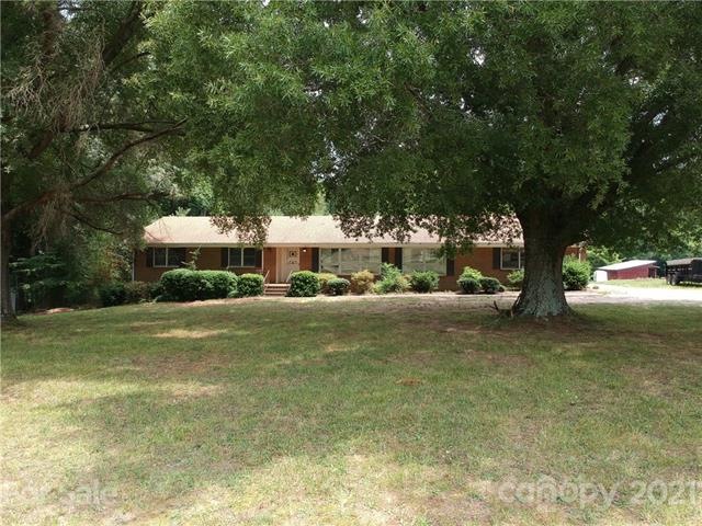 Welcome to 8294 Sherrills Ford Rd. This home sits off the road with gorgeous shade trees in the front yard.