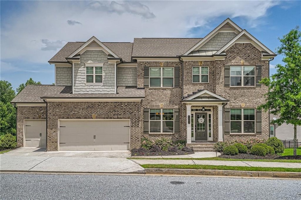 Craftsman-style house with a 3 car garage