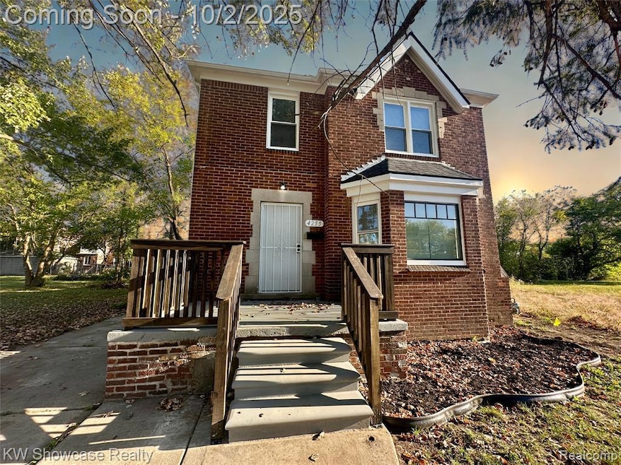 Traditional-style home featuring brick siding