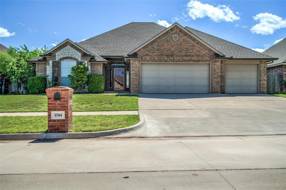 View of front facade featuring an attached garage