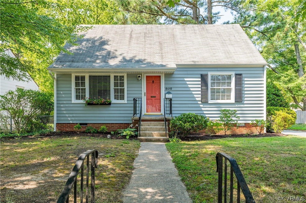 Cape cod-style house with a front lawn