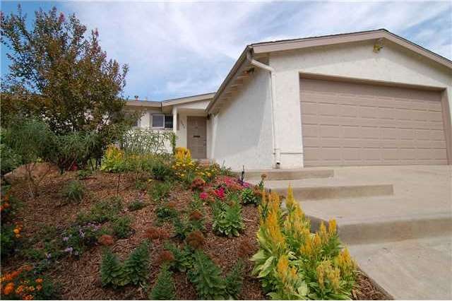 Great brick patio area  just above beautiful flowe