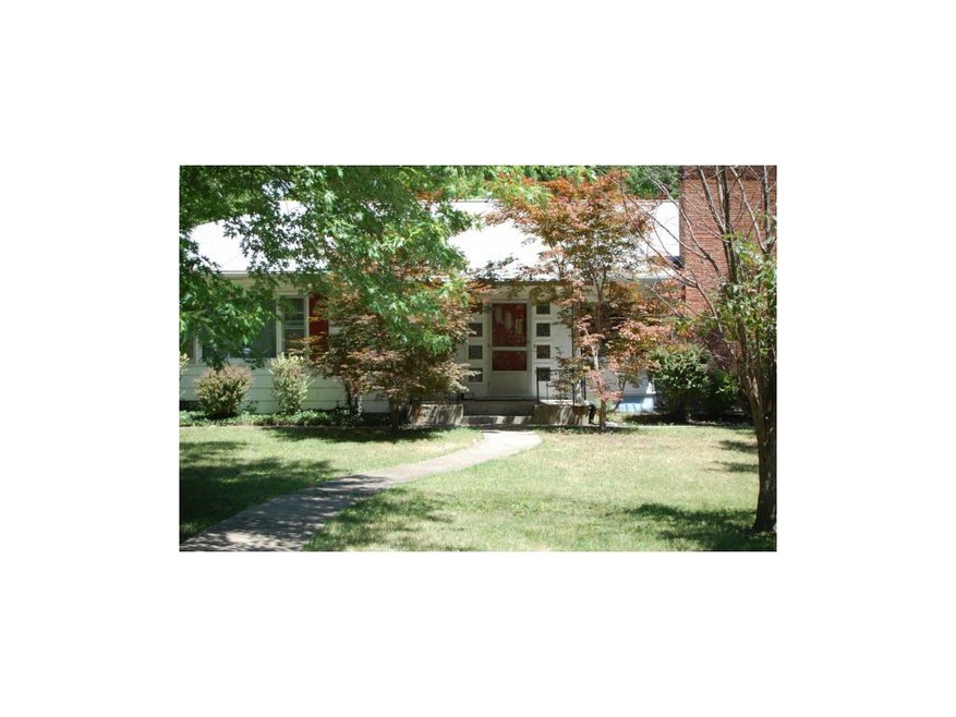 Shaded Front Porch Provides Access to Both Living 