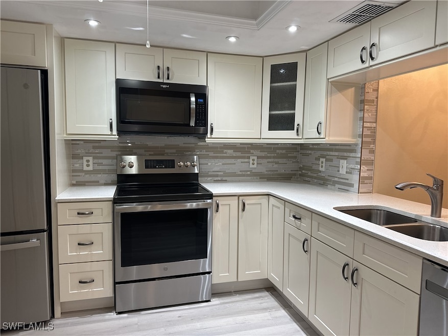Kitchen featuring sink, backsplash, ornamental mol