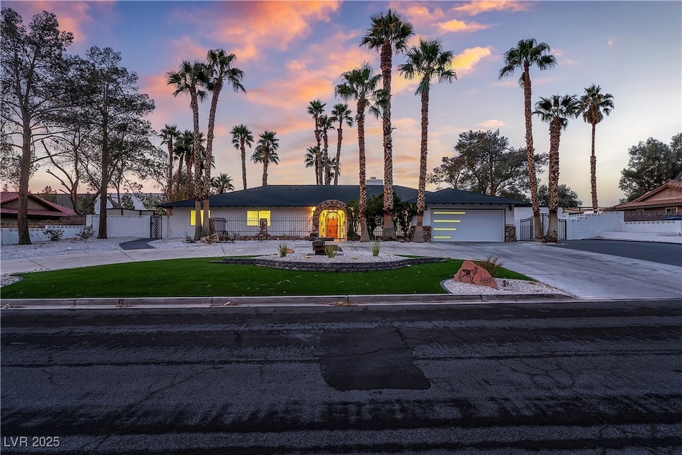 View of front facade with driveway, a garage, and