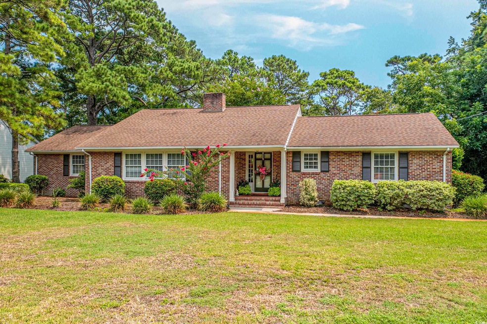 Single story home featuring a front yard