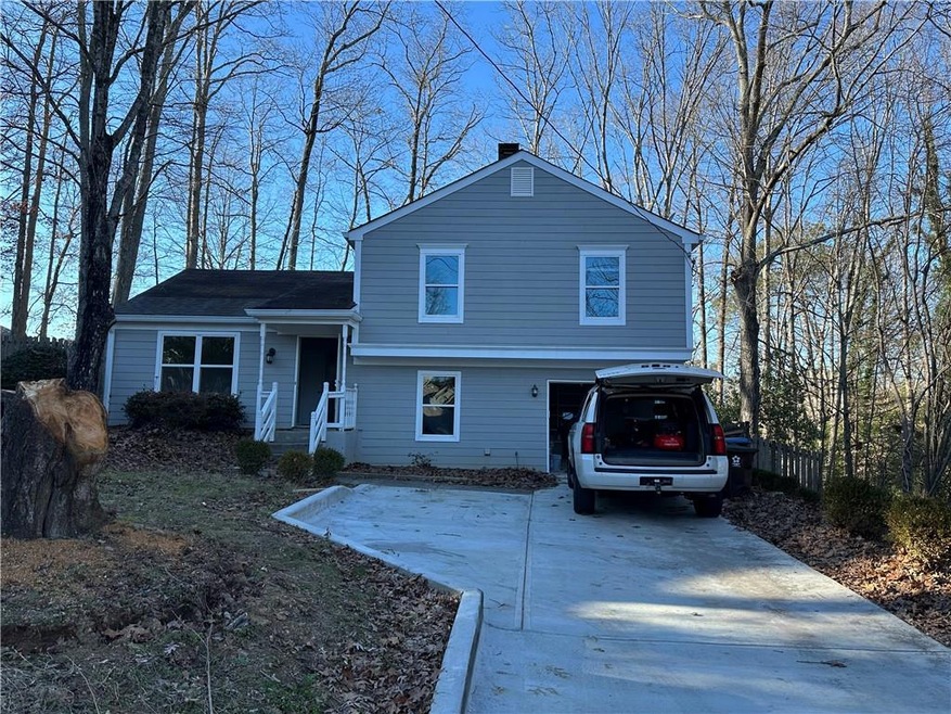 View of front of house featuring cooling unit
