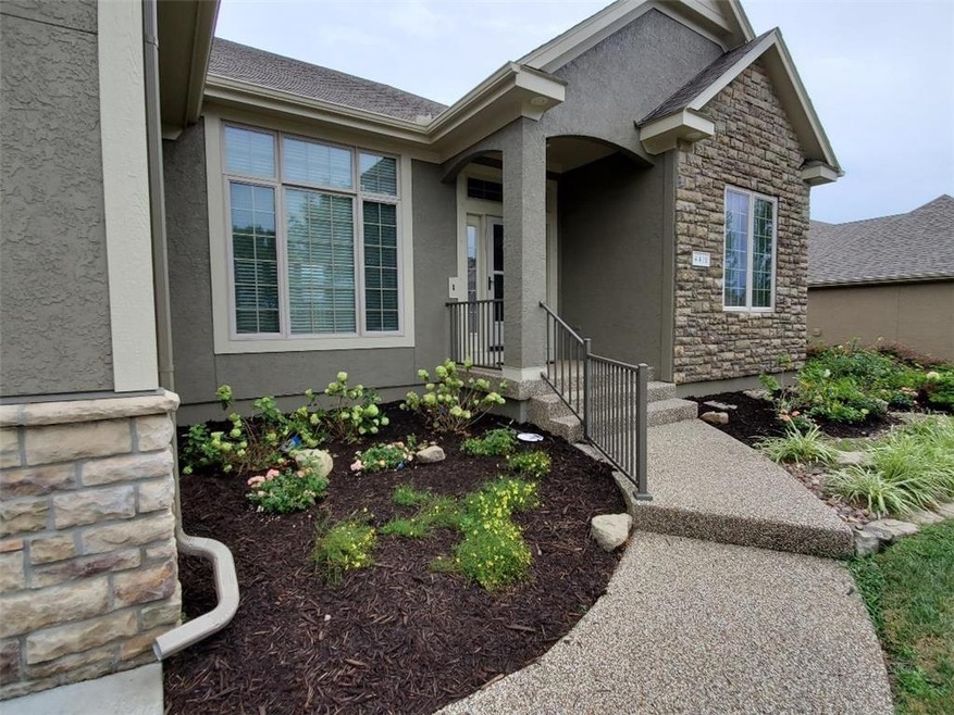 Pebbled walkway to the front porch. Freshly laid l