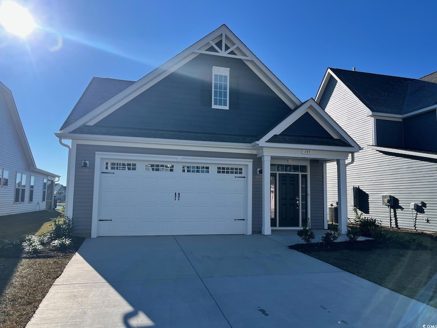 View of front of property featuring a garage