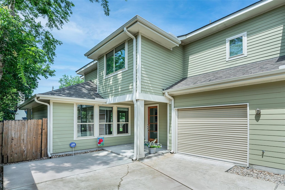 View of front of home with driveway, a shingled r