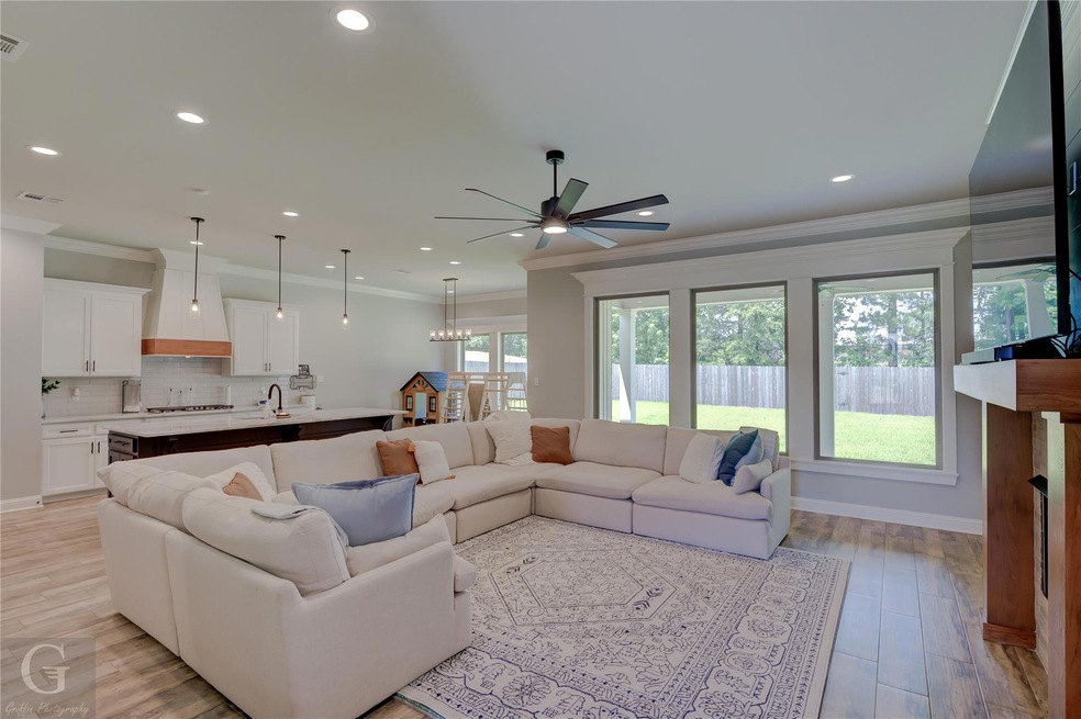 The open-concept floor plan seamlessly connects th