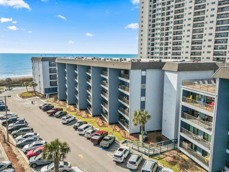 View of property with a water view and uncovered p