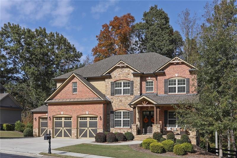 Gorgeous brick and stone home with inviting front 