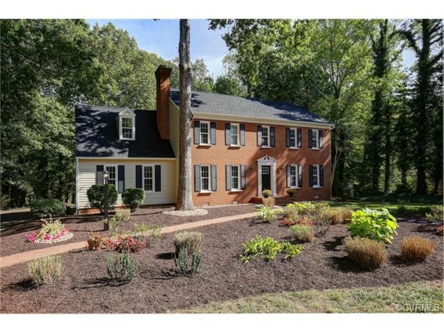 Stately Brick front Colonial situated on level par