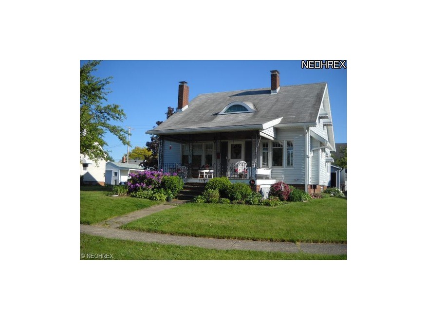 Cozy front porch with colorful flower bush, welcom