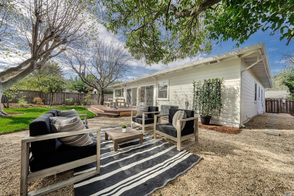 Big backyard with large lawn, outdoor living room and entertaining deck...