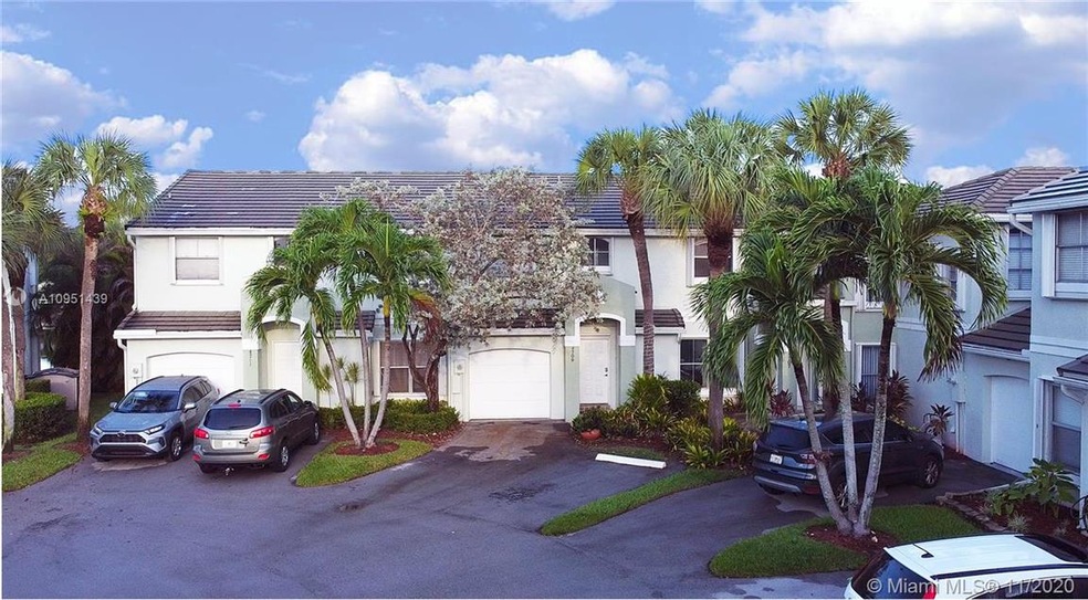 Front entrance with 2 assigned parking spaces.