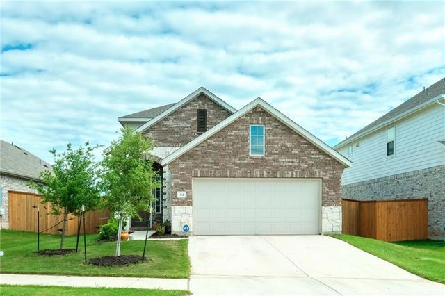 beautiful curbside with front facing garage and en