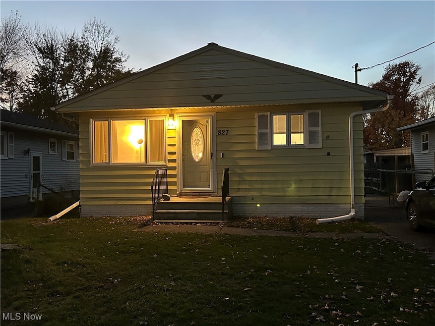 Bungalow-style house featuring a front lawn