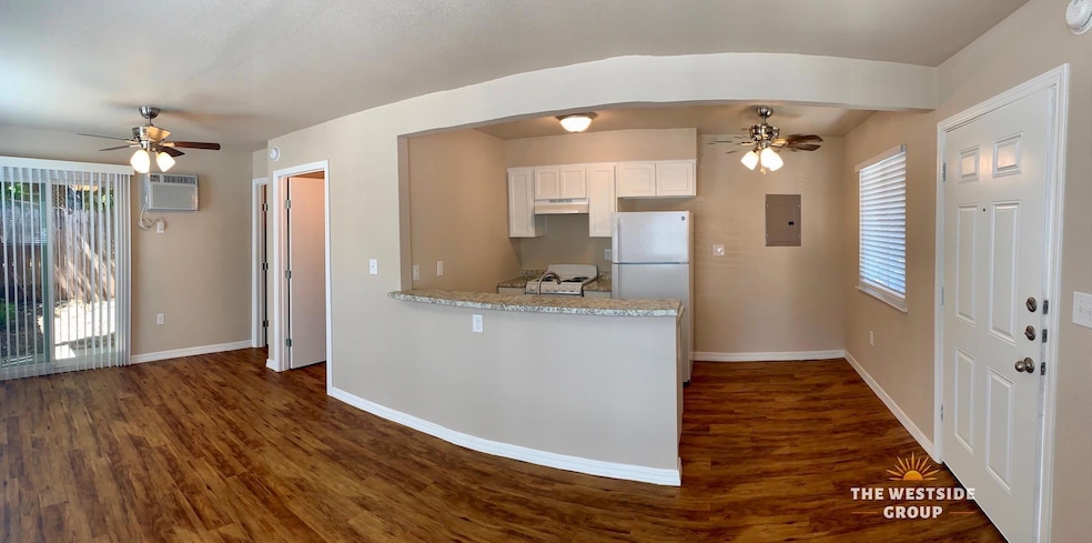 Kitchen featuring light countertops, white applia