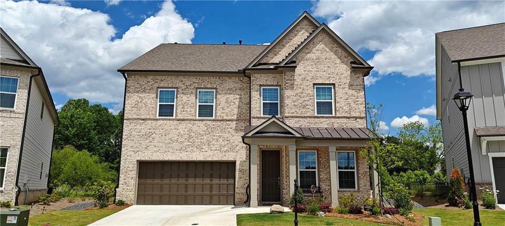 View of front of property featuring an attached ga