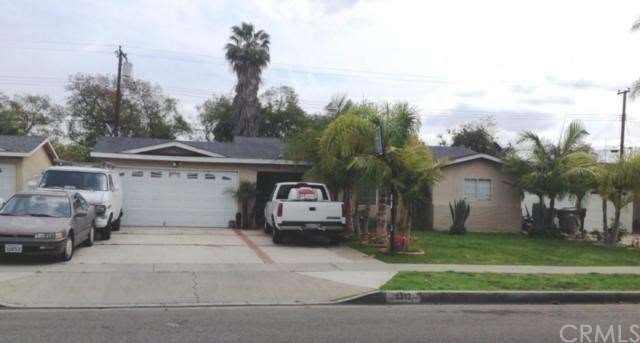 Front view with large driveway