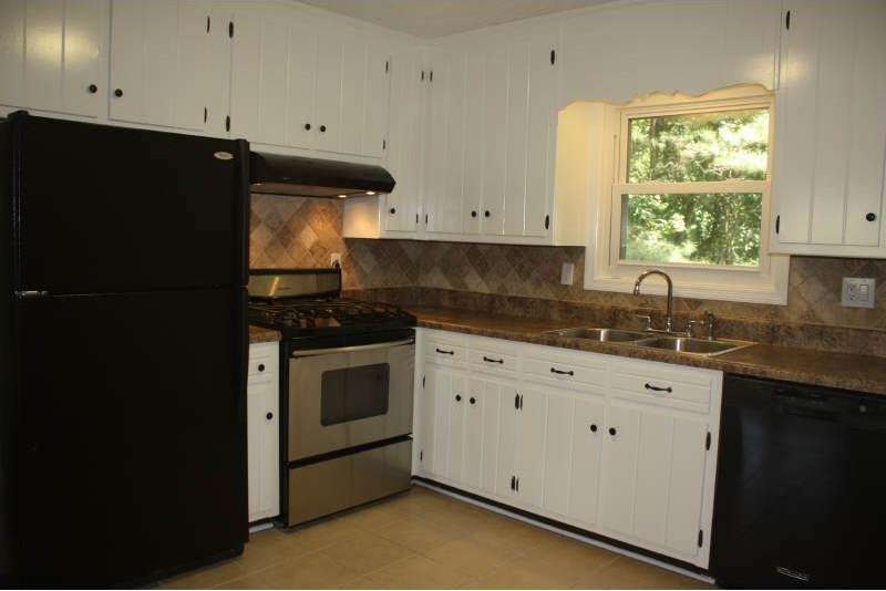 Newly painted cabinets plus new stone tile backspl