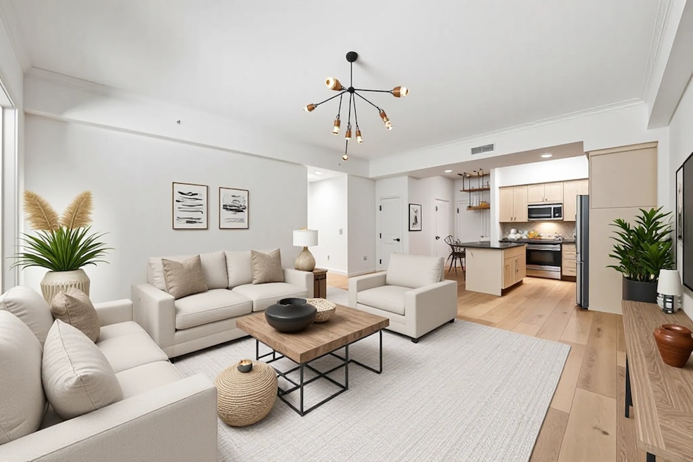 Virtually staged living and kitchen.